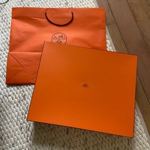Empty Hermès box with a Hermès shopping bag